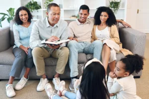 Family reading together on a couch.