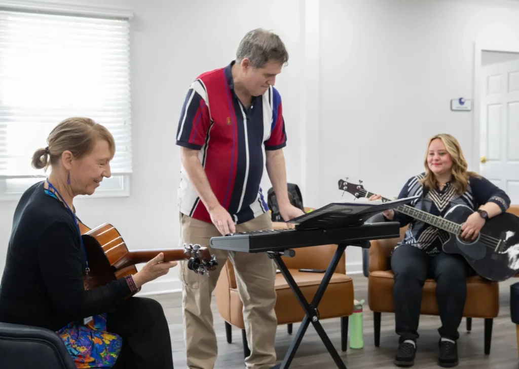 Real clients participating in music therapy at Rolling Hills Recovery Center.