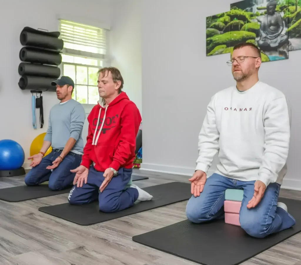 Real clients participating in yoga therapy at Rolling Hills Recovery Center.