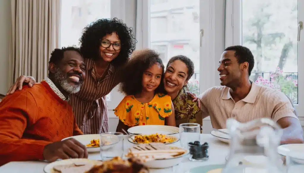 Family gathering around a dining table.