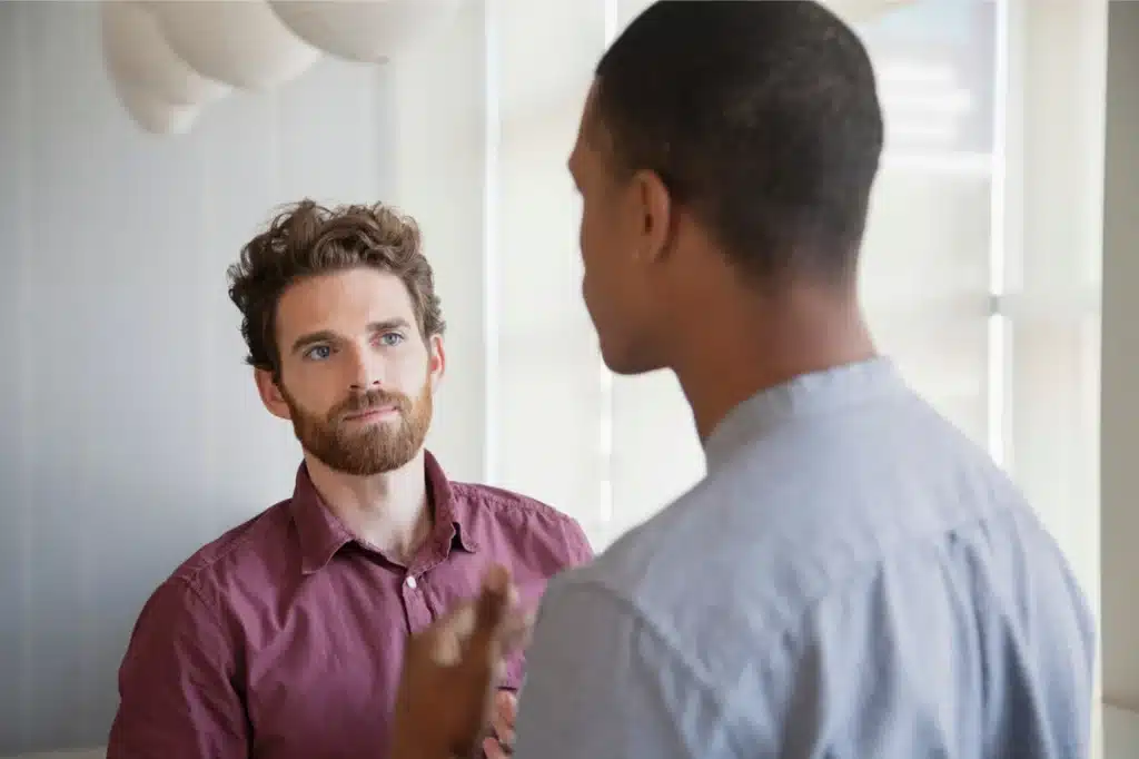 Two friends engaged in conversation.
