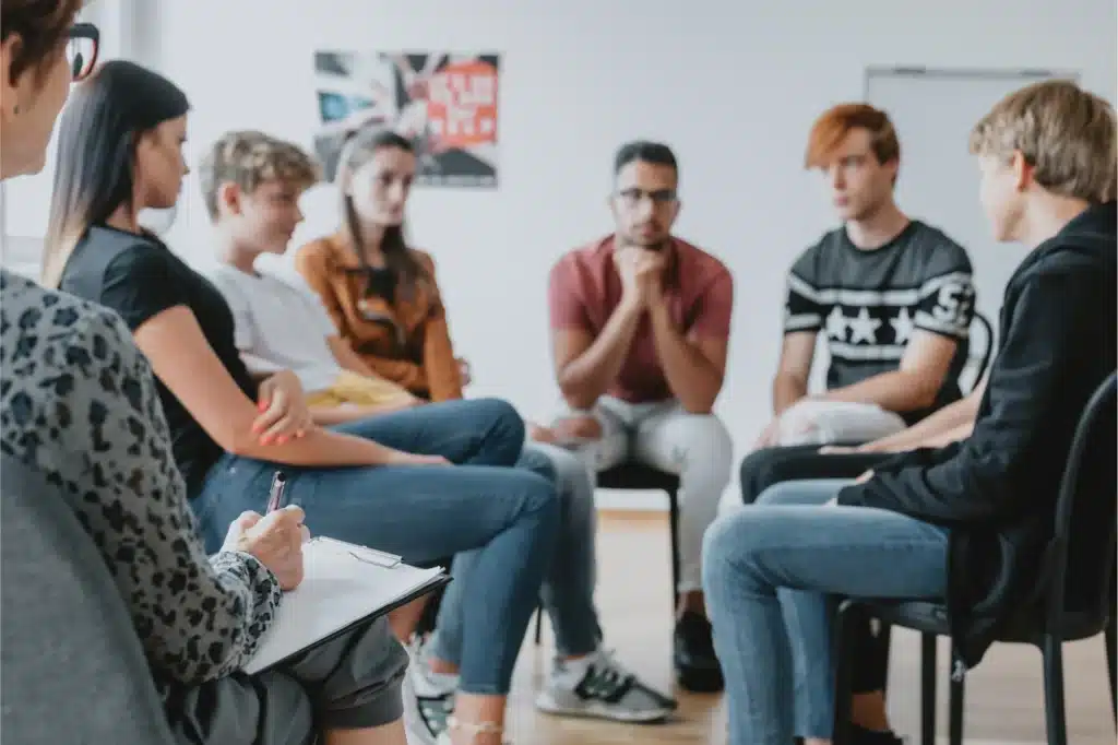 Support group discussion for alcoholism in session.