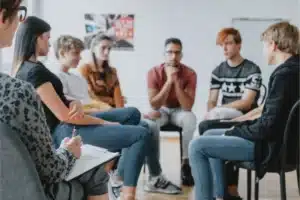 Support group discussion for alcoholism in session.
