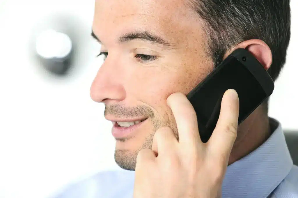 Man calling an Alcoholics Anonymous hotline in New Jersey to find a meeting or speak with support.