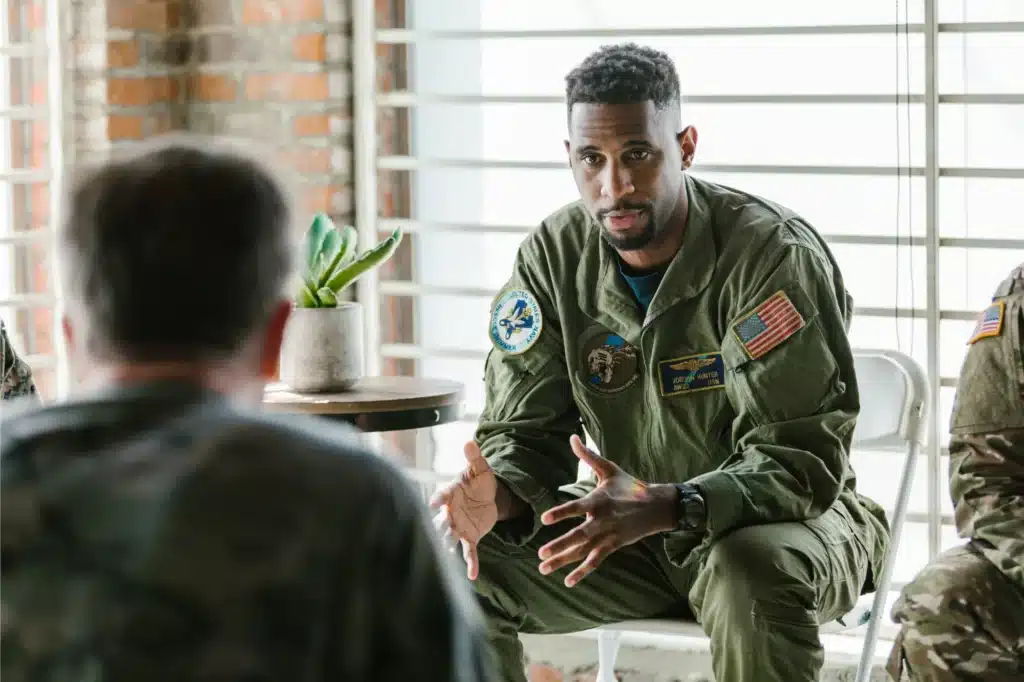 Veterans discussing ptsd and addiction in a support group.