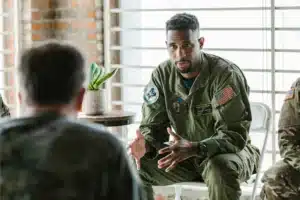 Veterans discussing ptsd and addiction in a support group.