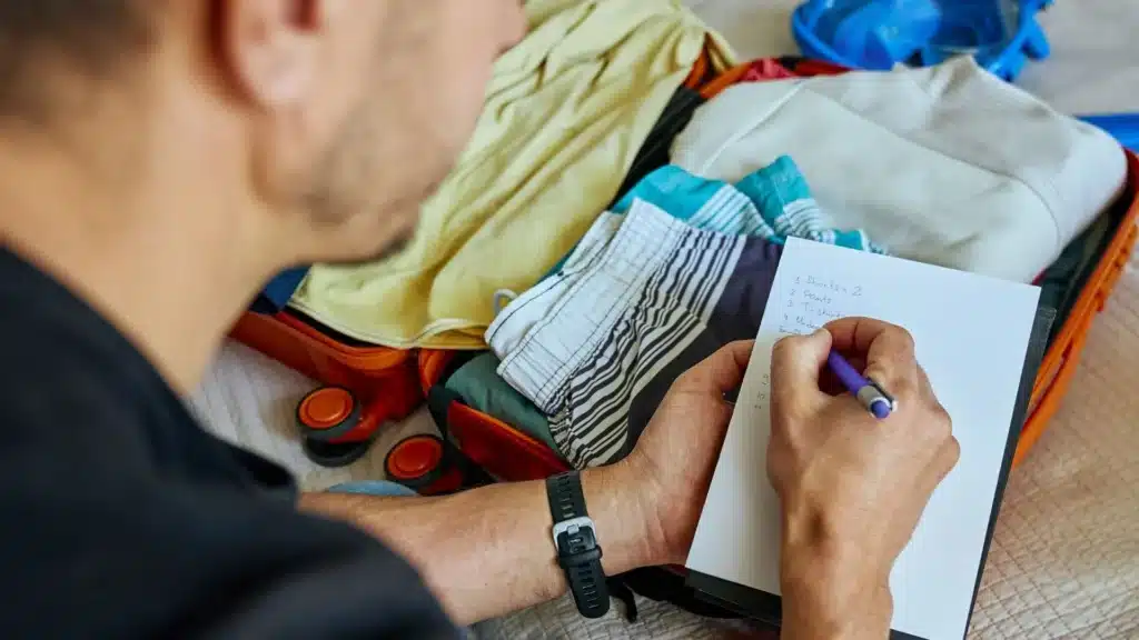 Stock photo of person reviewing rehab program checklist with a professional, illustrating how to evaluate ethical treatment options.