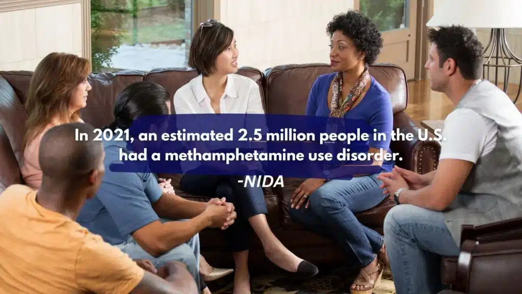 Group therapy session discussing methamphetamine addiction statistics, highlighting that 2.5 million people in the U.S. had a meth use disorder in 2021 according to NIDA.
