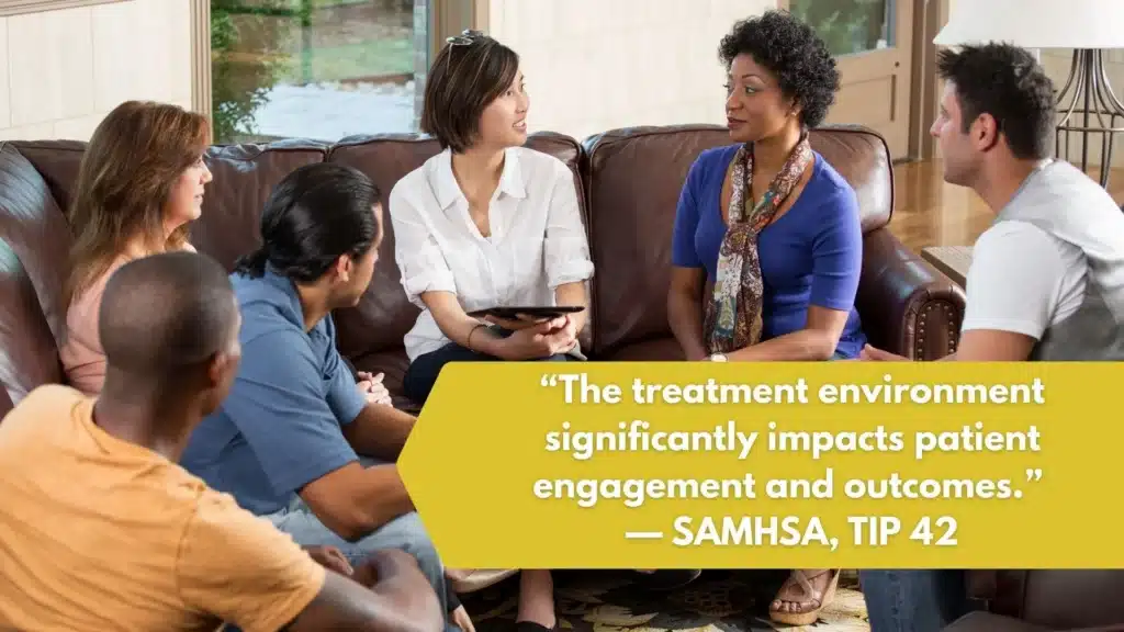 Modern drug rehab treatment center group room with natural light and supportive seating.
