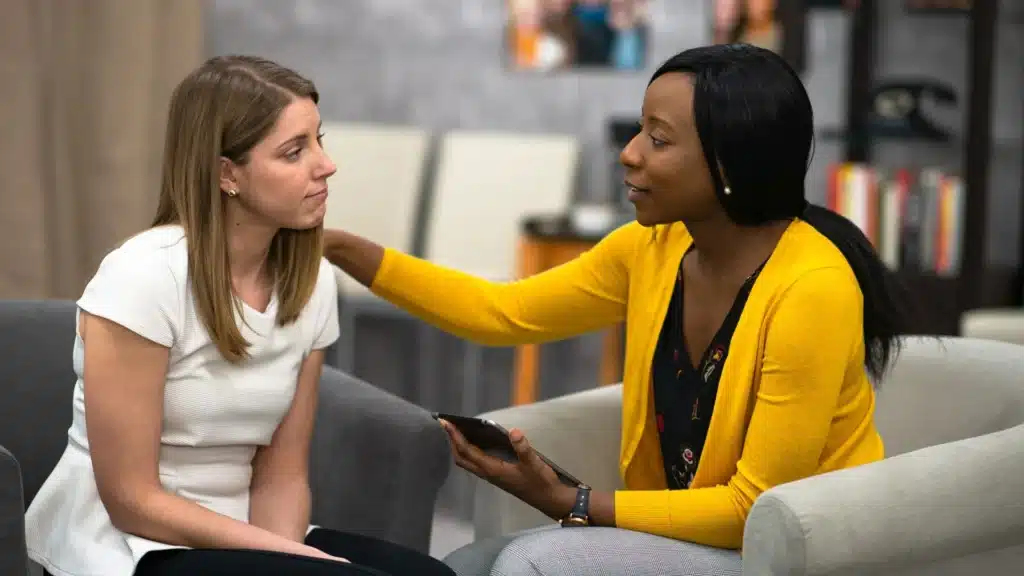 Clinician offering evidence-based support to a patient in a rehab program in New Jersey.