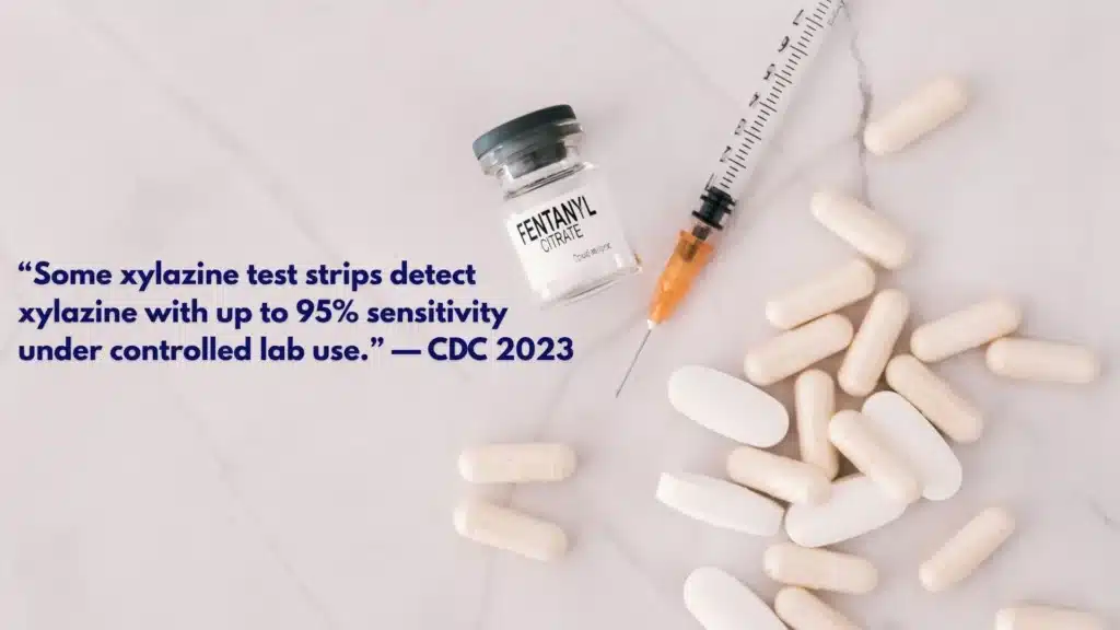 Person using fentanyl/xylazine test strips alongside a harm-reduction kit with gauze, saline, and naloxone.