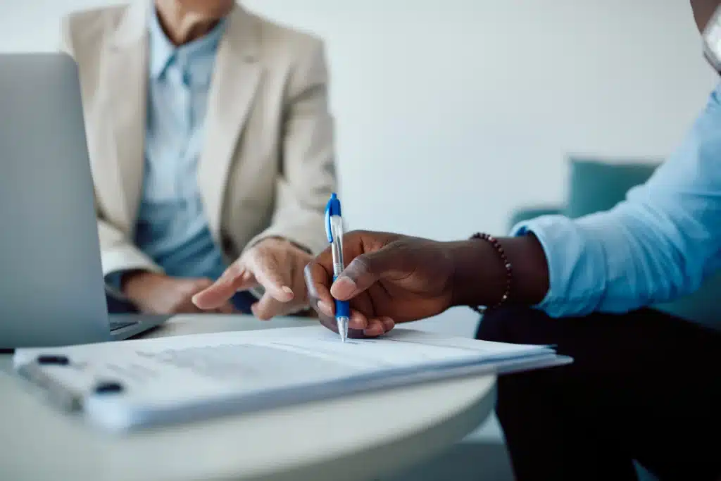 Person signing intake paperwork during a same-day drug and alcohol rehab admission process in New Jersey